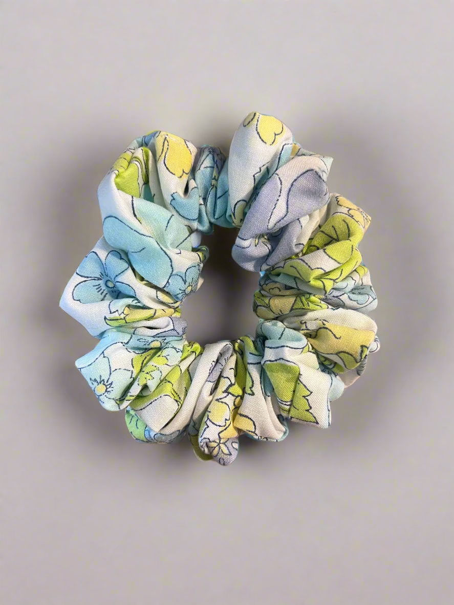 Floral patterned scrunchie on a white surface