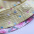 Fully reversible bucket hat made from two lovely cotton remnants, one yellow with birds and the other side a patchwork of pink button print fabrics.