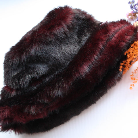 Dark burgundy faux fur winter hat. She is made using a beautiful dark burgundy remnant faux fur, with a complimenting cotton lining.