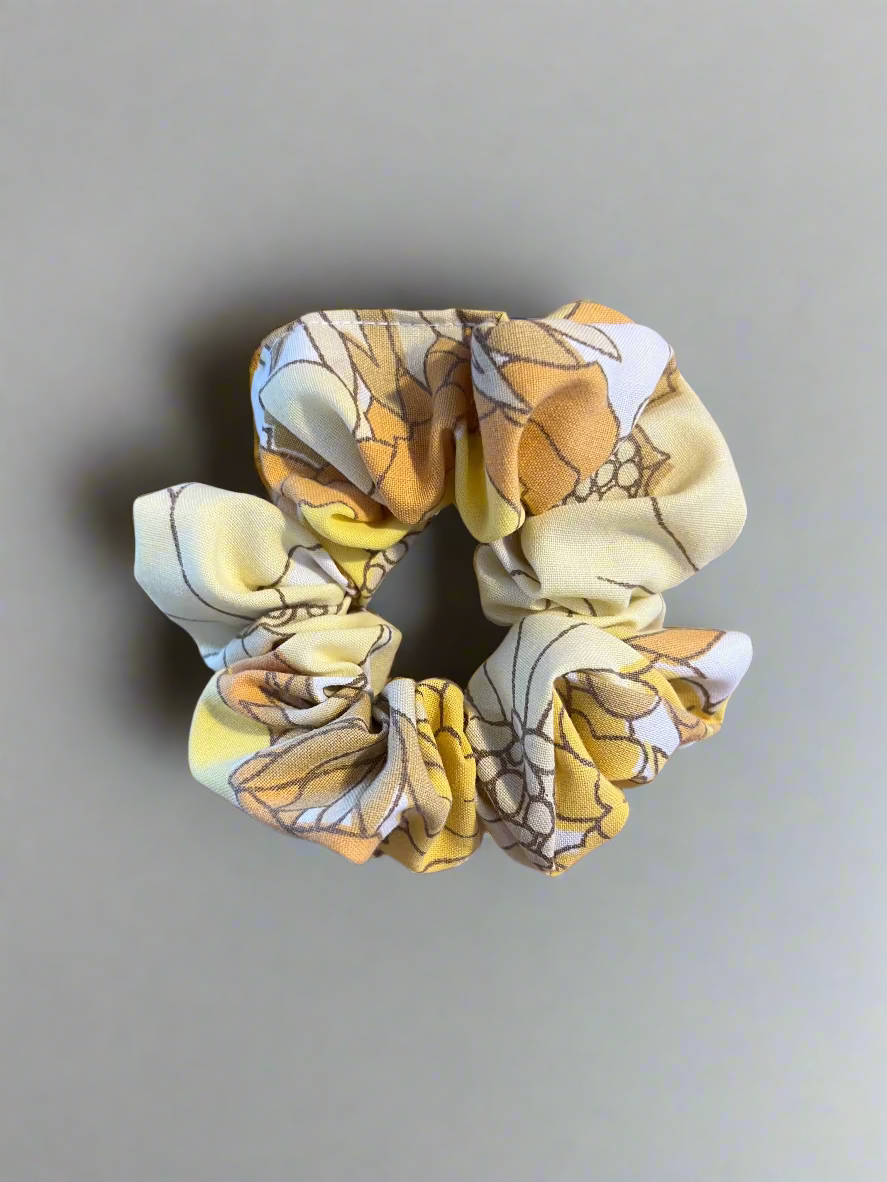 Floral patterned scrunchie on a white surface