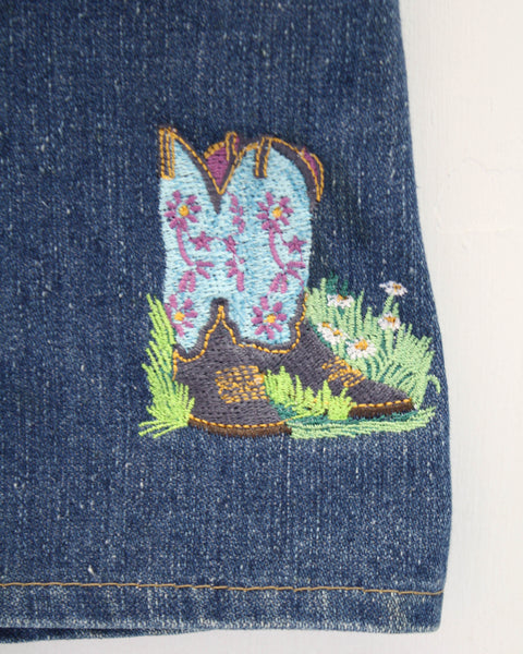 Embroidered patch vintage denim skirt. Embroidered to front with a sun and moon design, and to the back with some gorgeous cowboy boots. Made from a vintage denim skirt found in a charity shop.