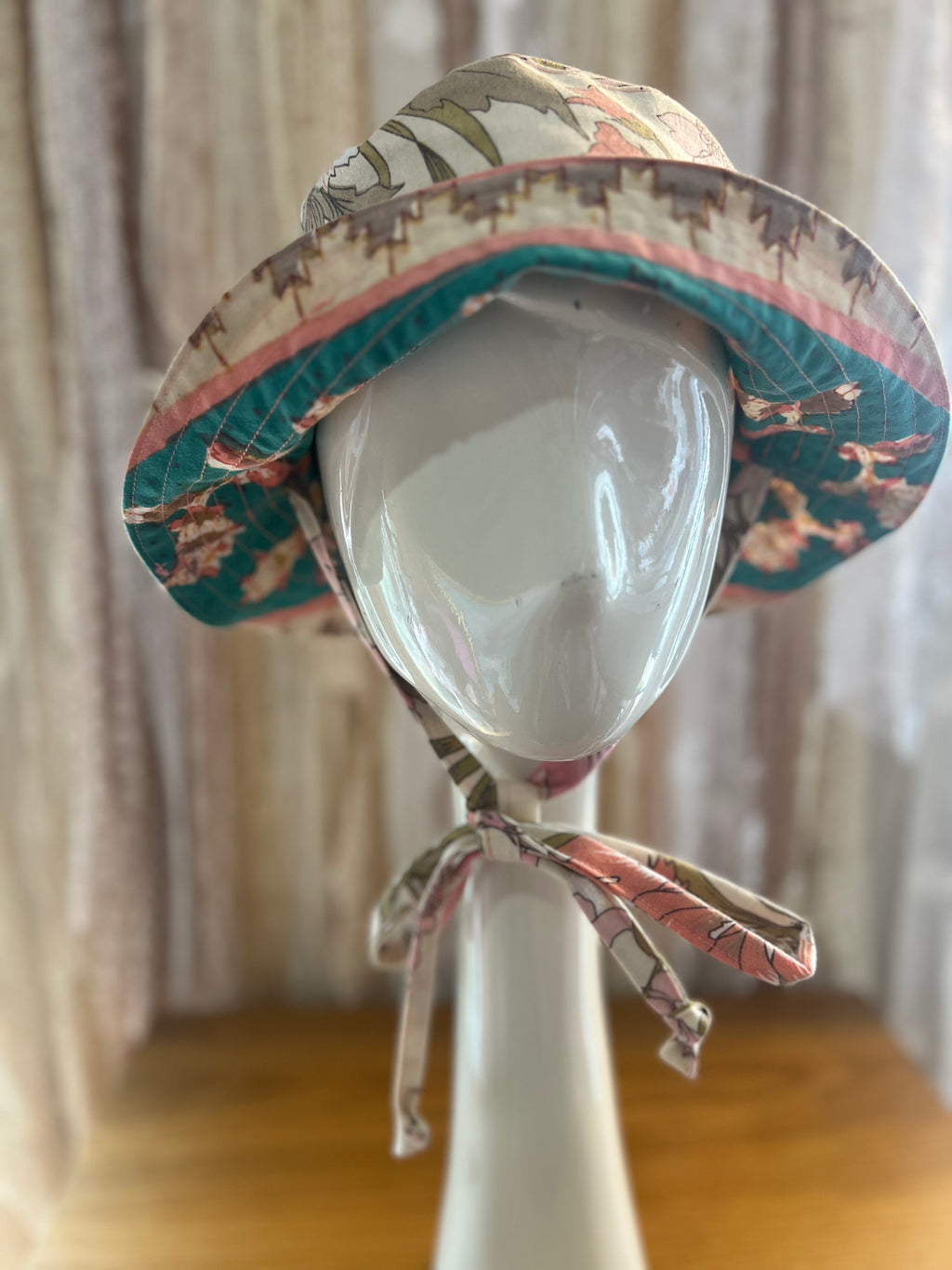 Colorful sun hat on a mannequin head with a blurred background