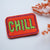 Embroidered patch with 'CHILL' slogan in green and pink