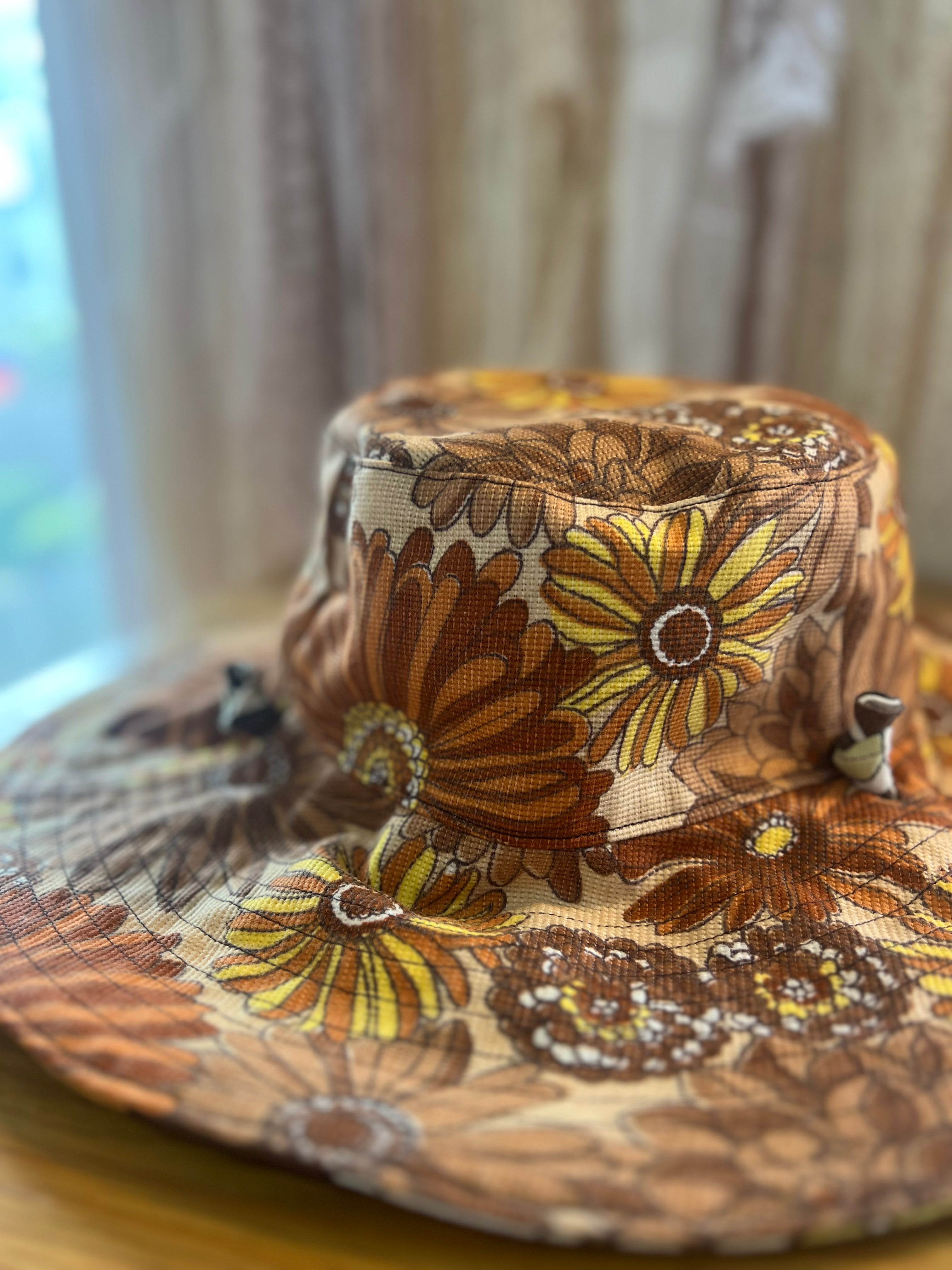Floral patterned bucket hat on a neutral background