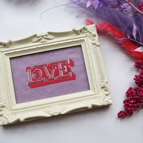 'LOVE’ framed embroidery, made using a remnant lilac wool mix fabric and a beautiful 'LOVE’ font embroidery.